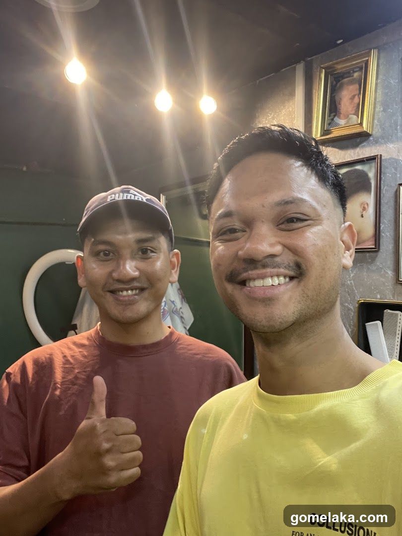 Two men in a barbershop interior