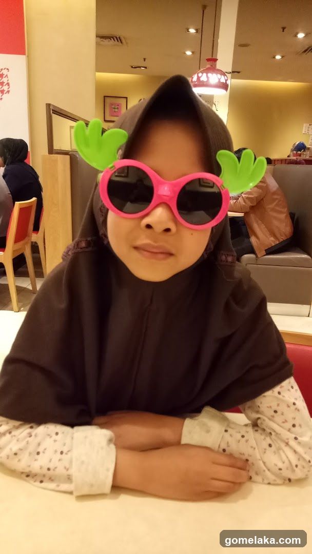 Child in restaurant interior