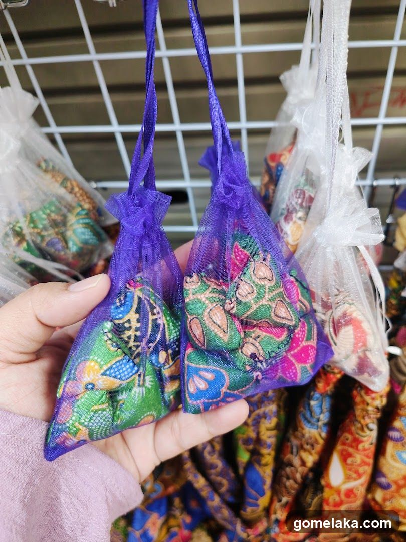 Hand holding decorative sachets