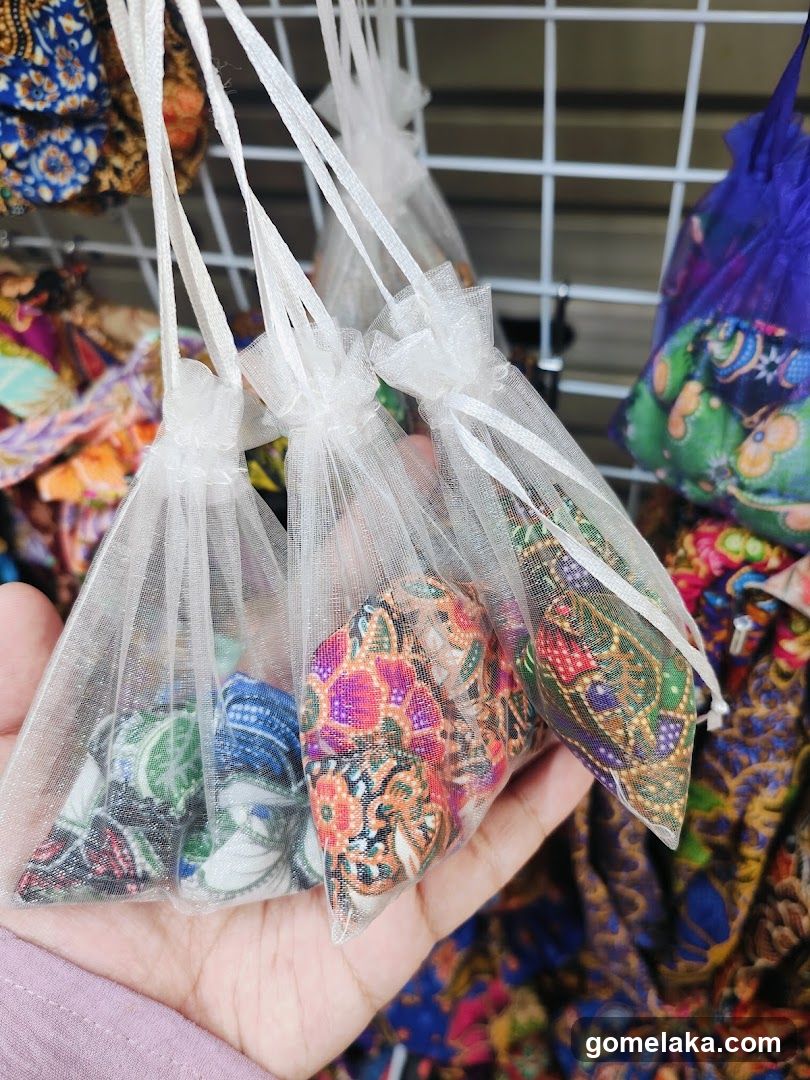 Hand holding fabric bags