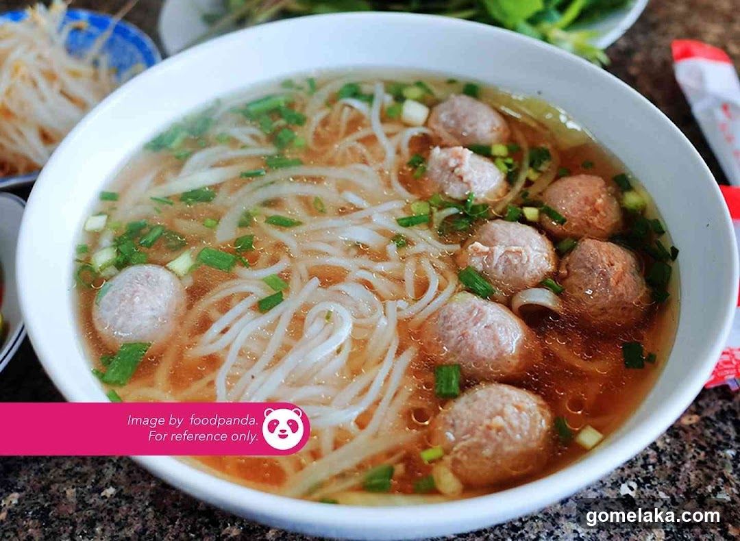 Bowl of noodle soup with meatballs