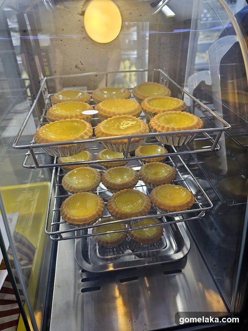 Display of Egg Tarts in Glass Case
