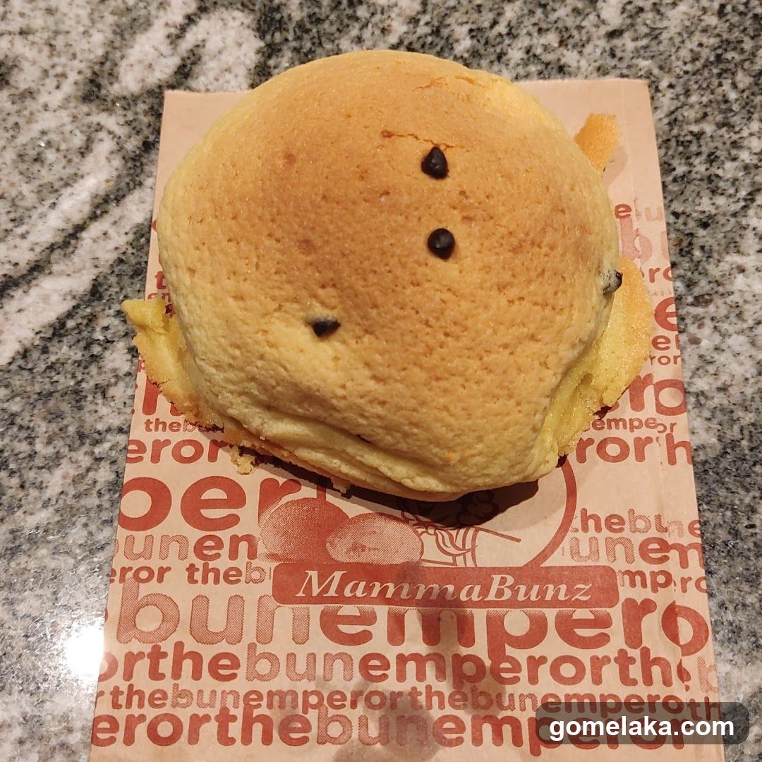 Bun with Chocolate Dots on Paper