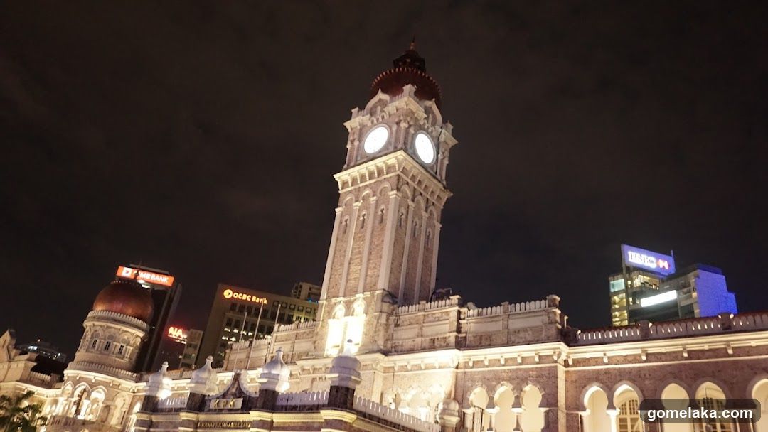 Nighttime architectural view of a historic building with clock tower