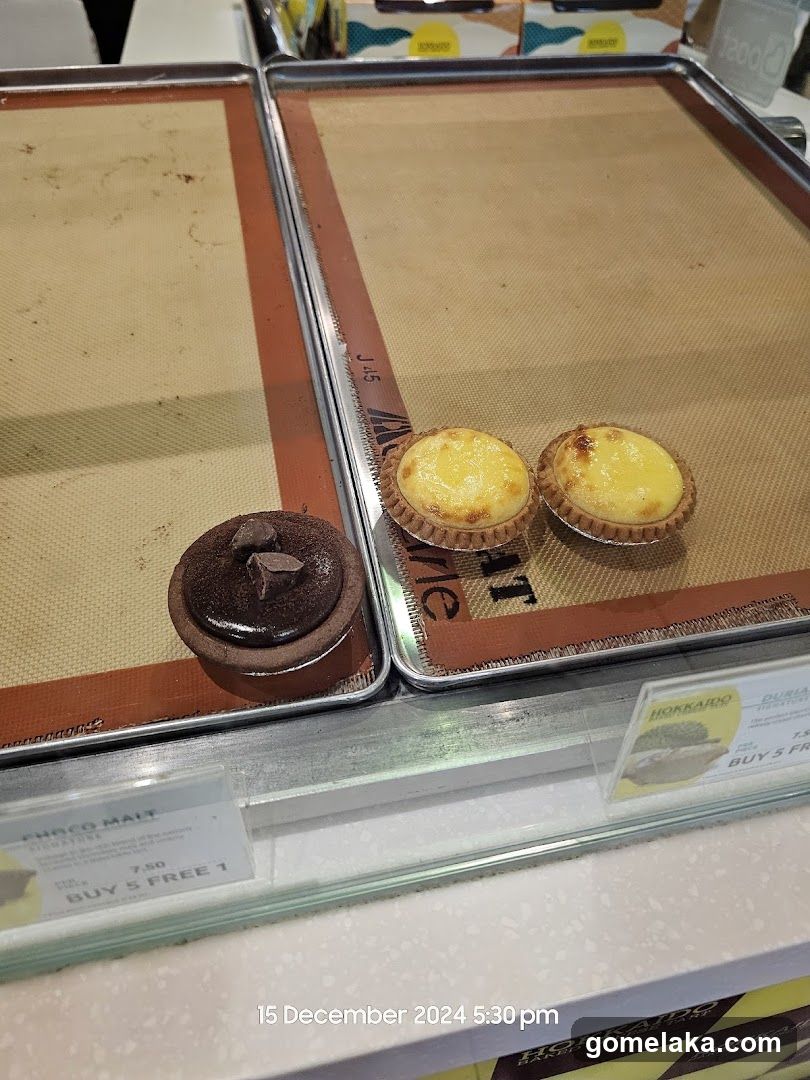 Display of Pastries in Refrigerated Case