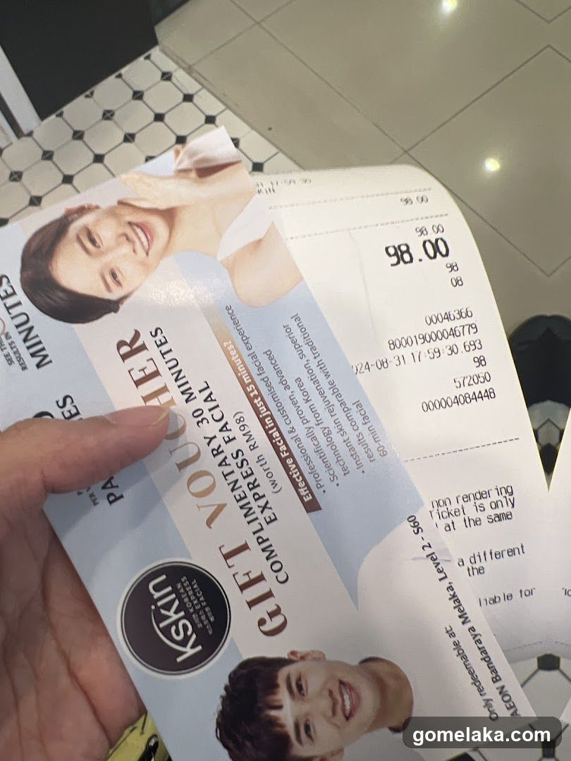 Hand holding promotional material and receipt