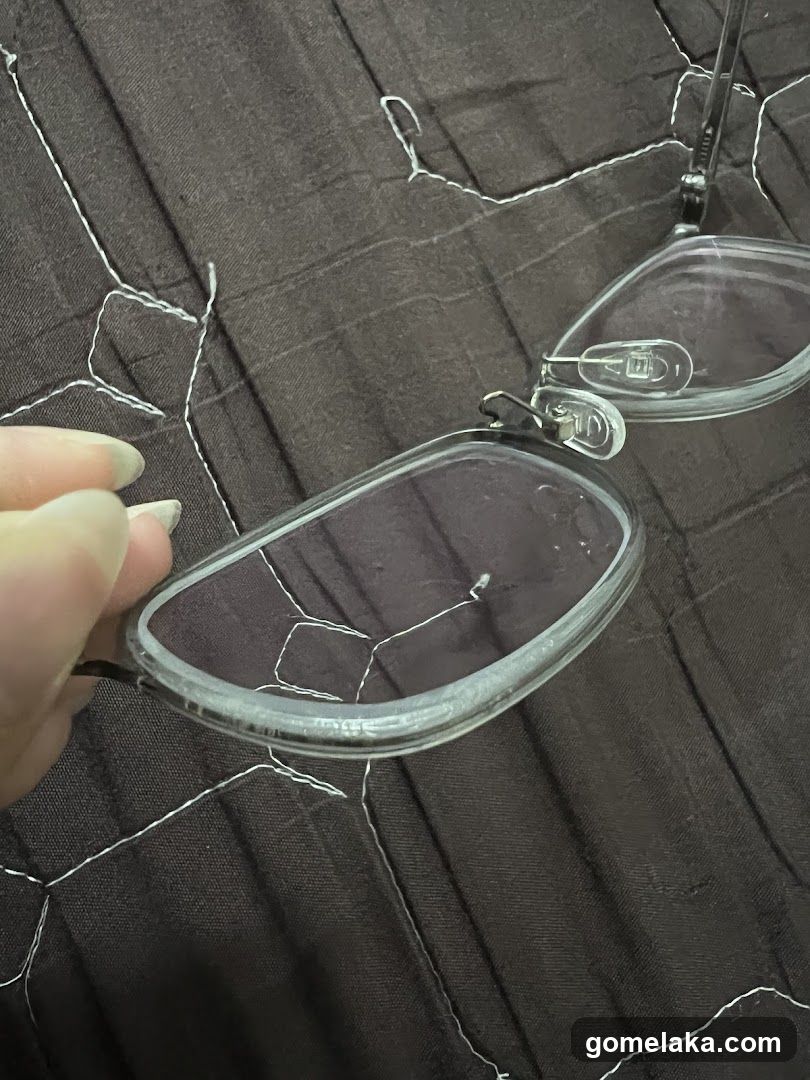 Hand holding glasses on fabric