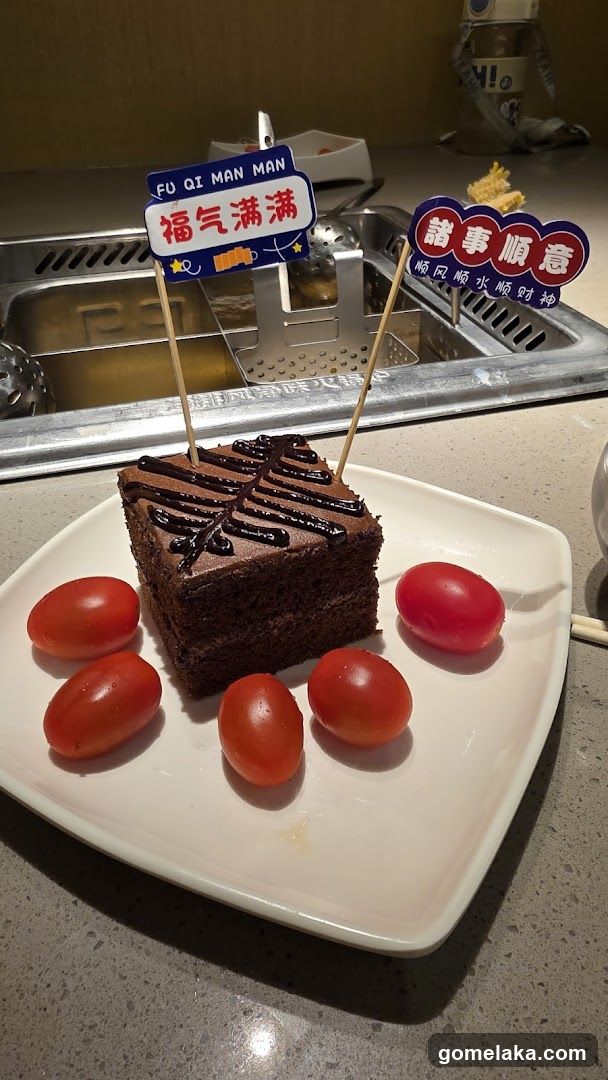 Chocolate Cake with Cherry Tomatoes and Decorative Sticks