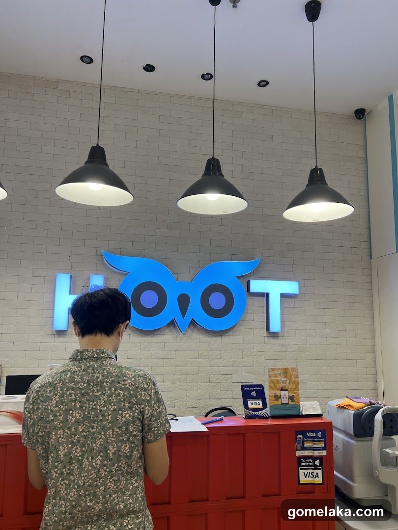Interior of a business with 'HOO T' sign