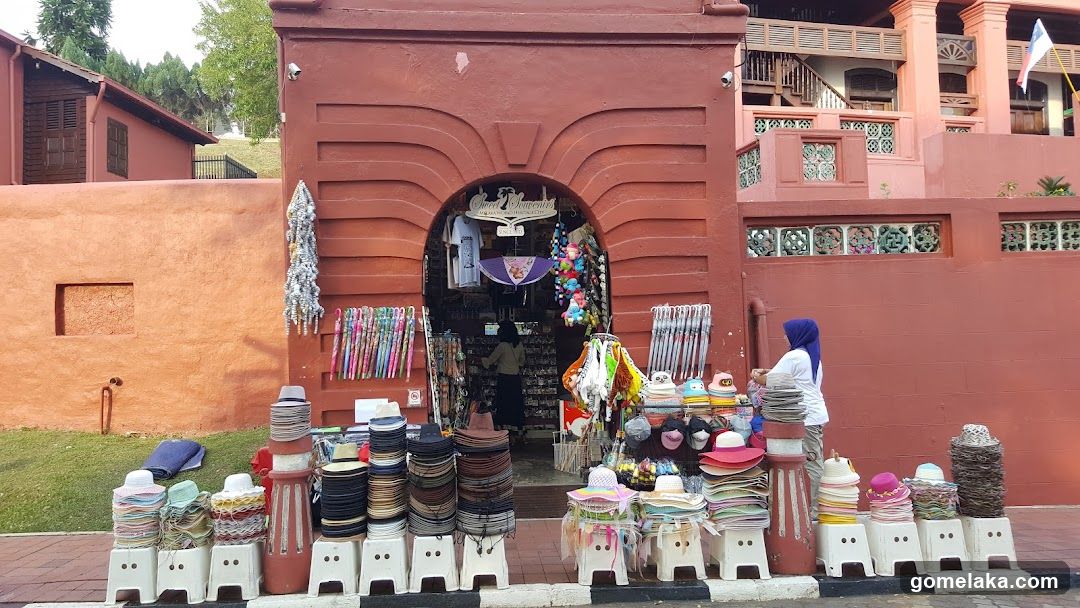 Market stall outside red building