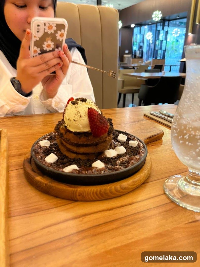 Customer taking photo of dessert