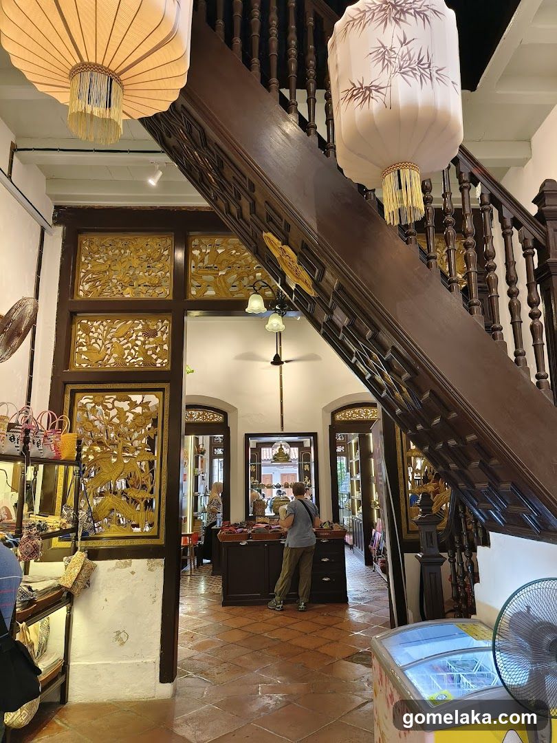 Interior of traditional shop with staircase and lanterns