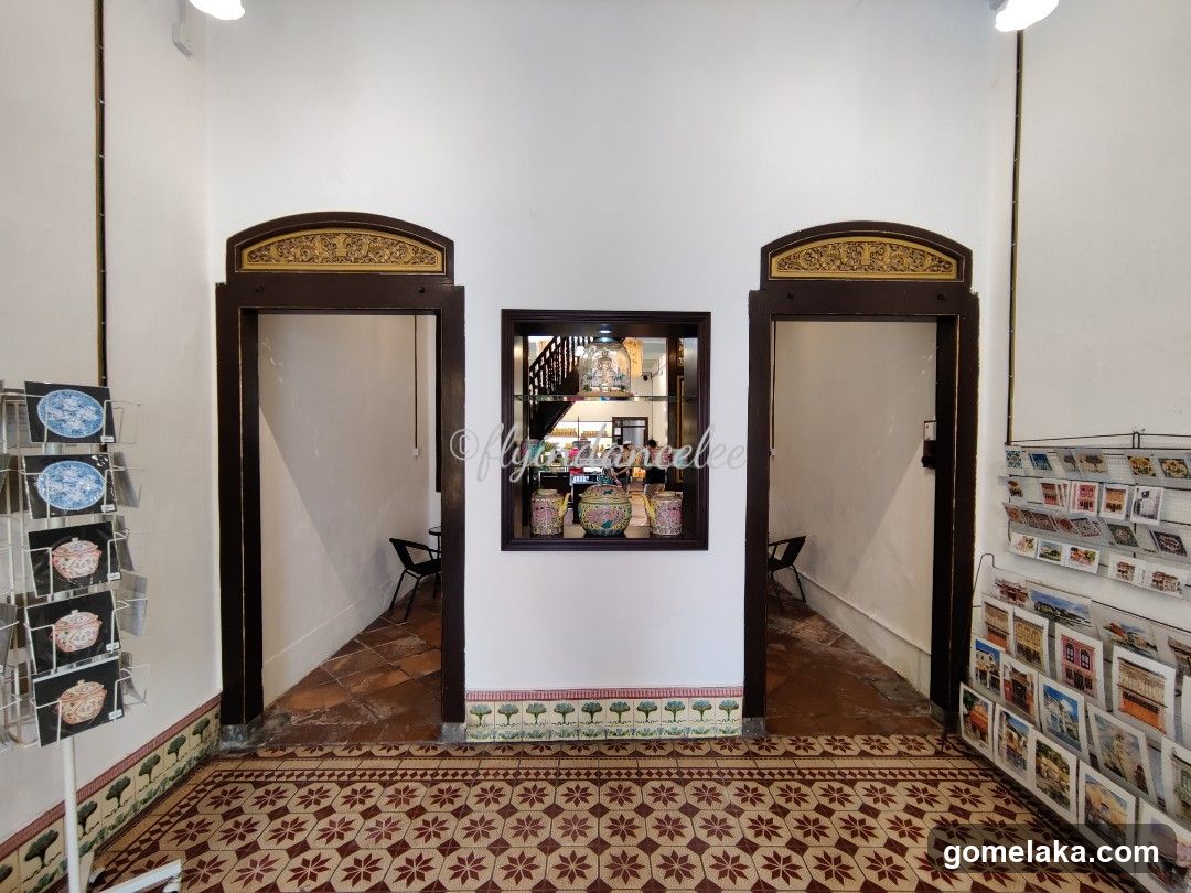 Interior hallway with decorative doors and tiled floor