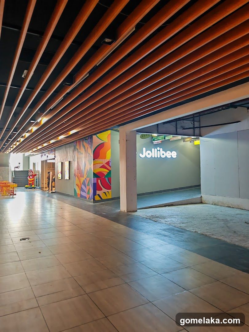 Interior corridor with Jollibee storefront
