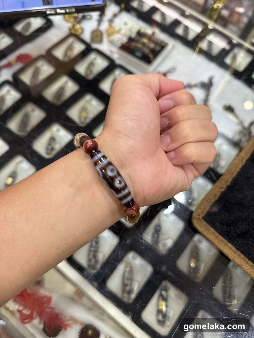 Hand wearing bracelet in jewelry store