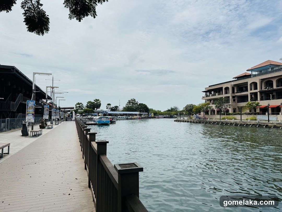 Waterfront promenade with buildings and boats