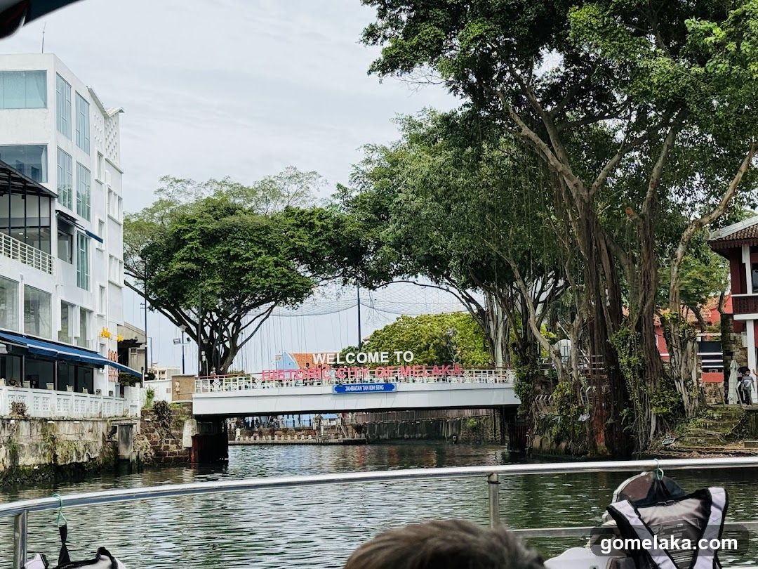 Riverfront View with Bridge Signage