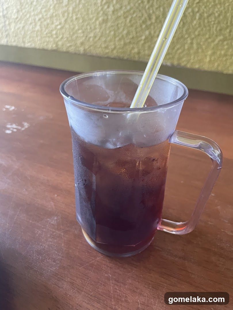 Iced beverage in mug with straw
