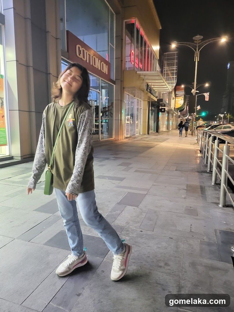 Person on sidewalk at night