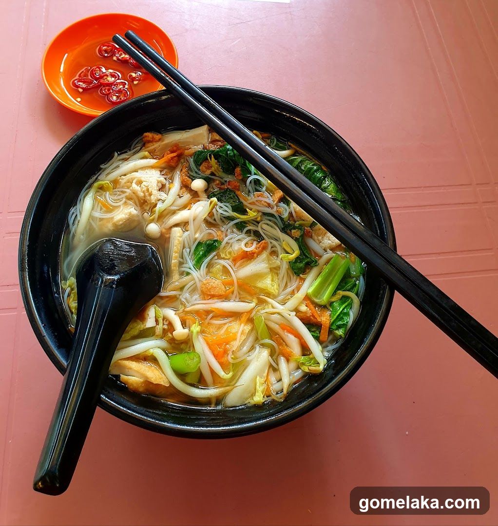 Lunch bowl with chopsticks and side dish