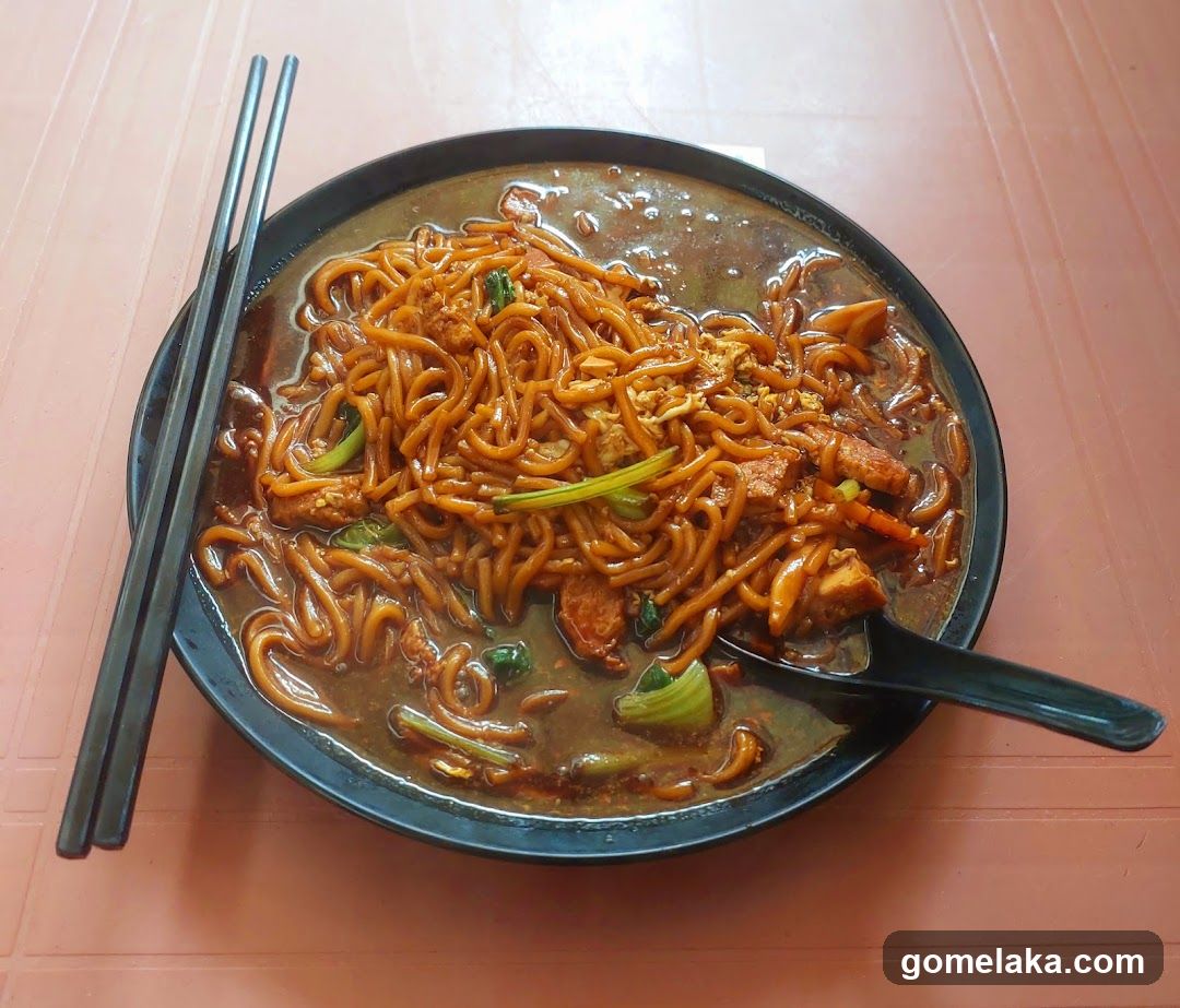 Noodles Dish with Chopsticks and Spoon