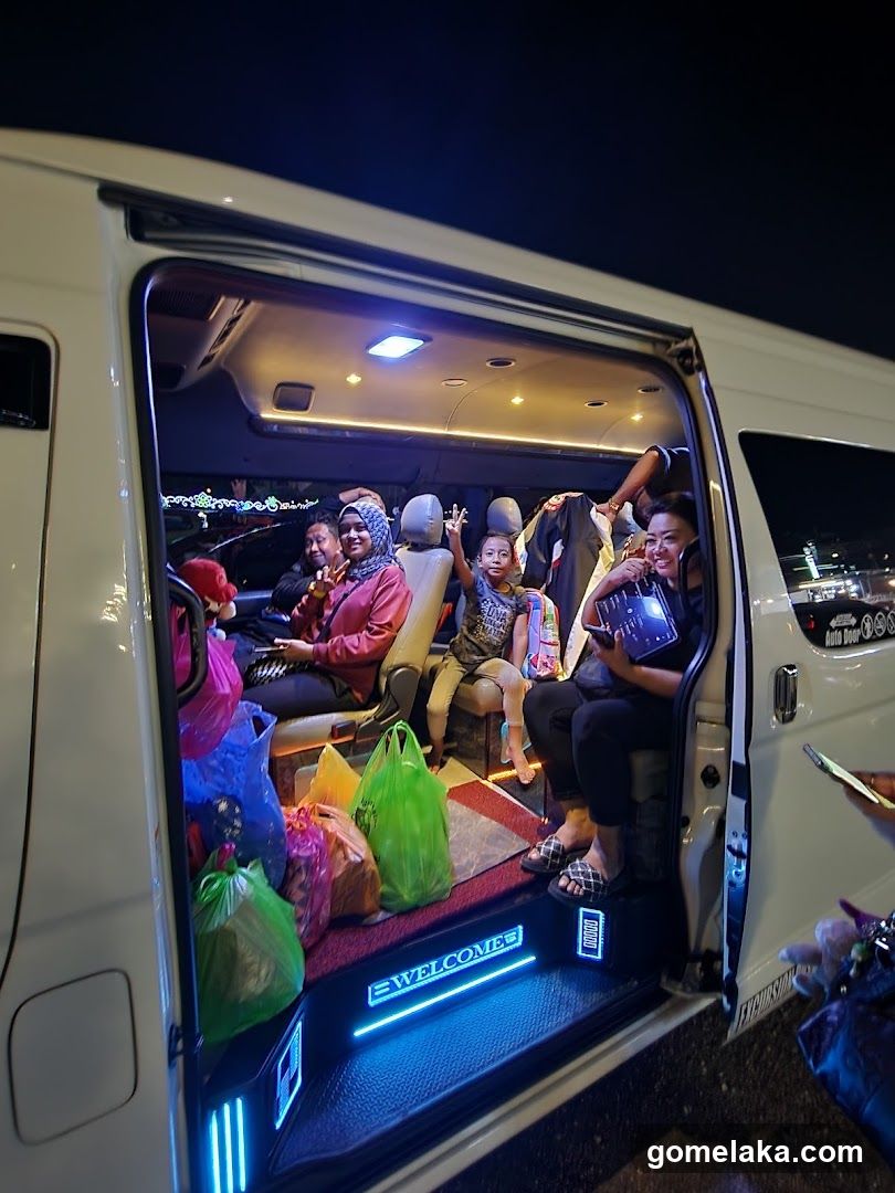Group in a luxury van at night