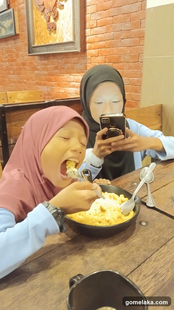 Two individuals dining indoors