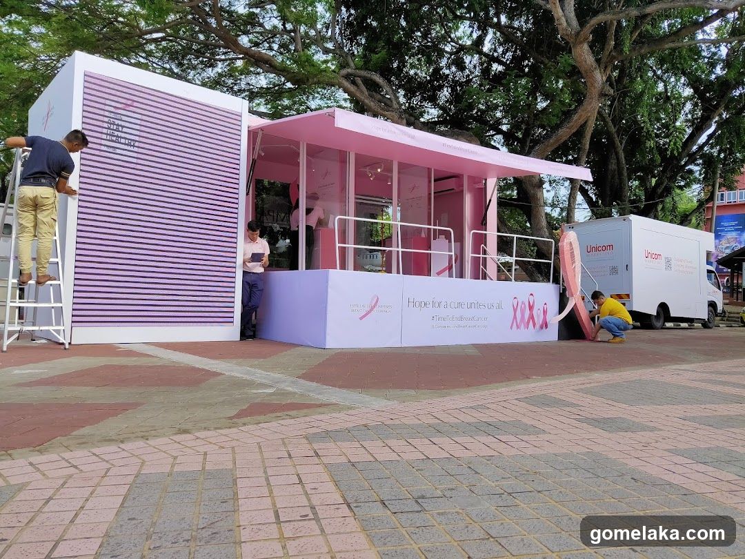 Pink-themed outdoor event booth