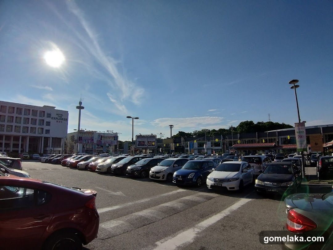 Parking Lot with Buildings and Cars