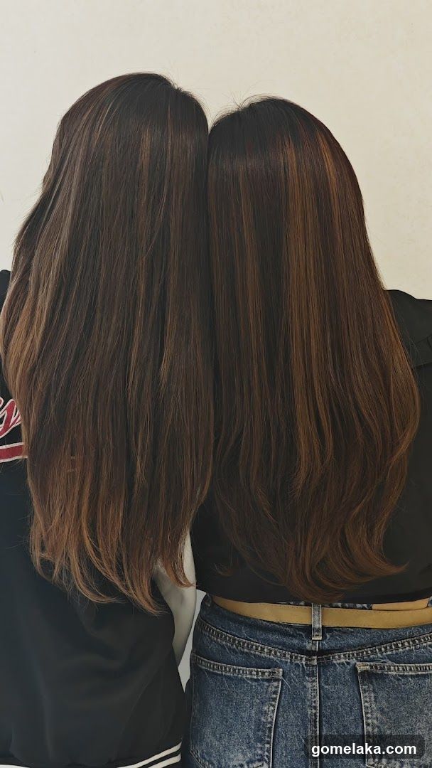 Two individuals with long hair