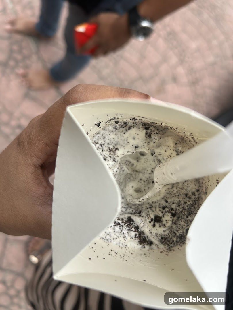 Hand holding a dessert drink