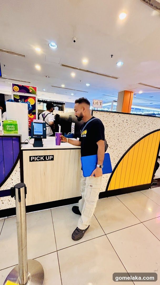 Customer at GrabFood pickup counter