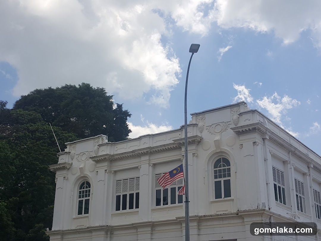 White Colonial Building with Malaysian Flag