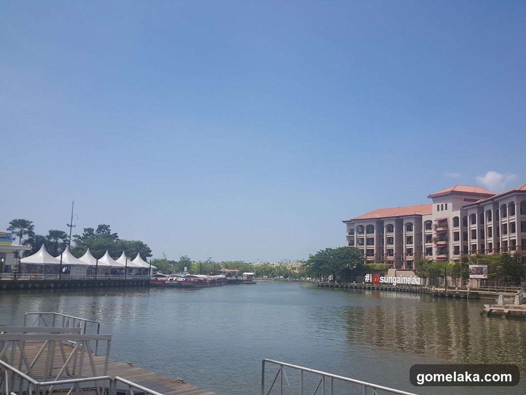 Riverfront View with Building and Tents