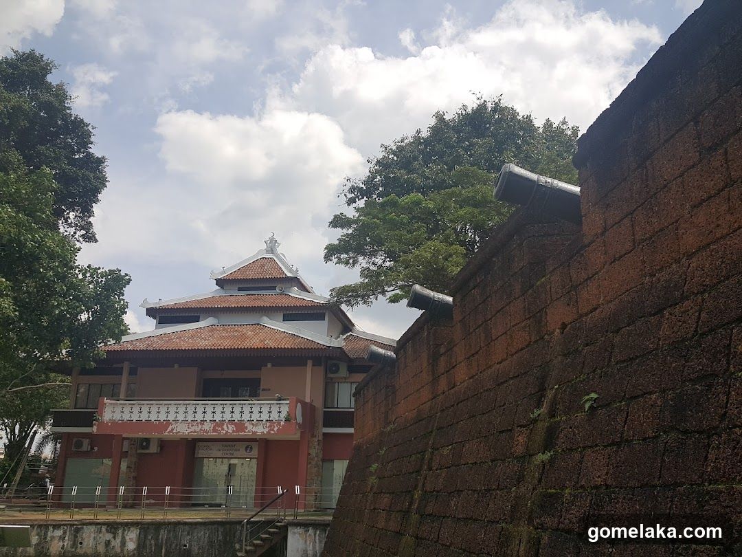 Building with Red Brick Wall and Trees