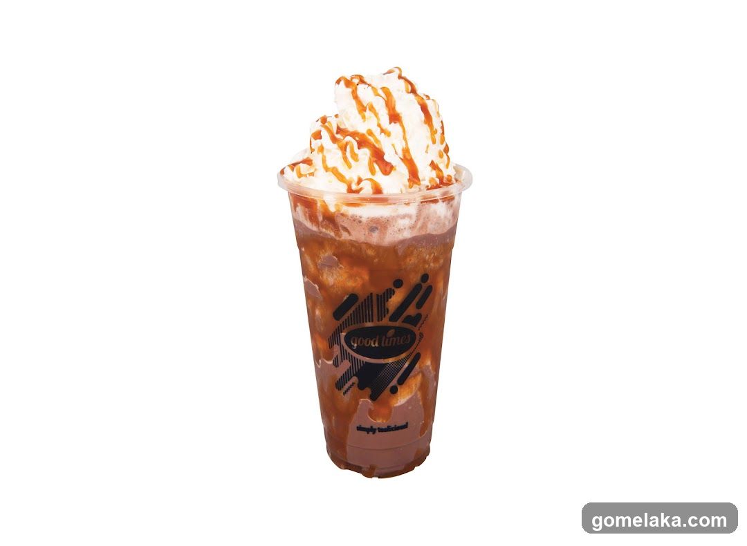 Iced beverage with whipped cream and caramel drizzle