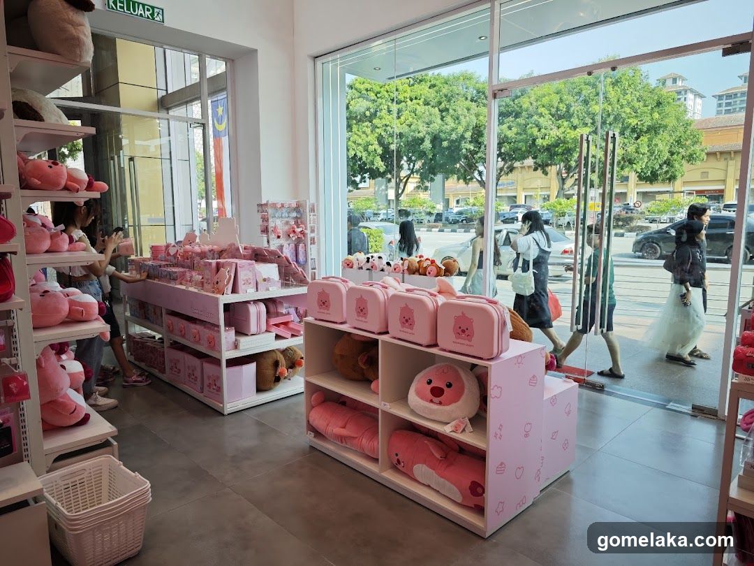 Interior of a pink-themed merchandise store