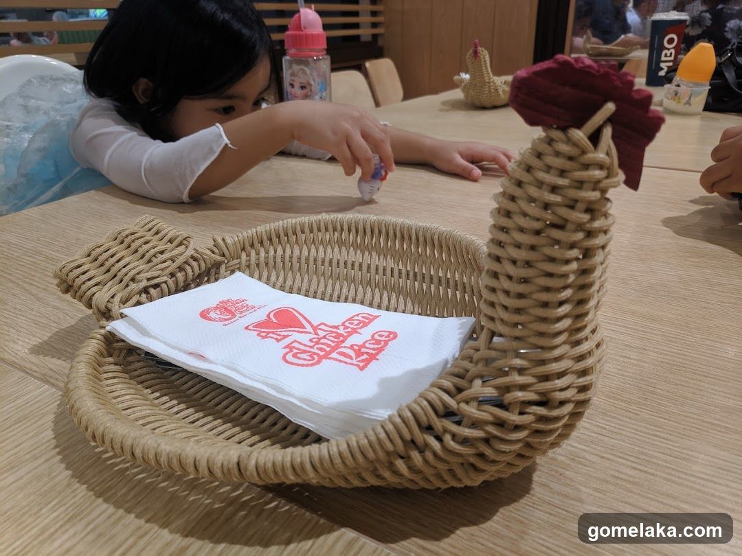 Restaurant Interior with Child and Chicken Rice Napkin