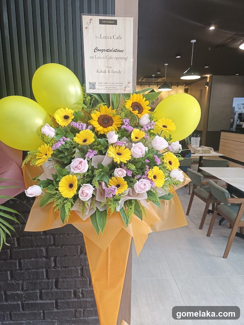Floral Arrangement with Balloons and Congratulations Sign
