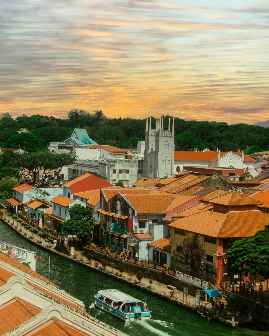 Riverside murals along Melaka River Cruise route